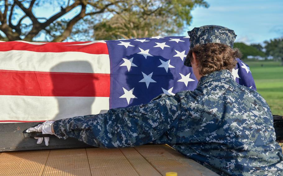 U.S. Navy Electronics Technichian First Class Kelly Creason, a member of the Defense POW/MIA Accounting Agency, transports a casket during a disinterment ceremony March 4, 2019, at the National Memorial Cemetery of the Pacific in Honolulu. DPAA’s mission is to provide the fullest possible accounting of missing personnel to their families and the nation.
