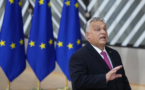 Hungary's Prime Minister Viktor Orban speaks with the media as he arrives for an EU summit at the European Council building in Brussels, Thursday, Oct. 26, 2023. European Union leaders gather Thursday for a two day meeting to discuss, among other issues, Ukraine and the impact of the war between Israel and Hamas. (AP Photo/Virginia Mayo)