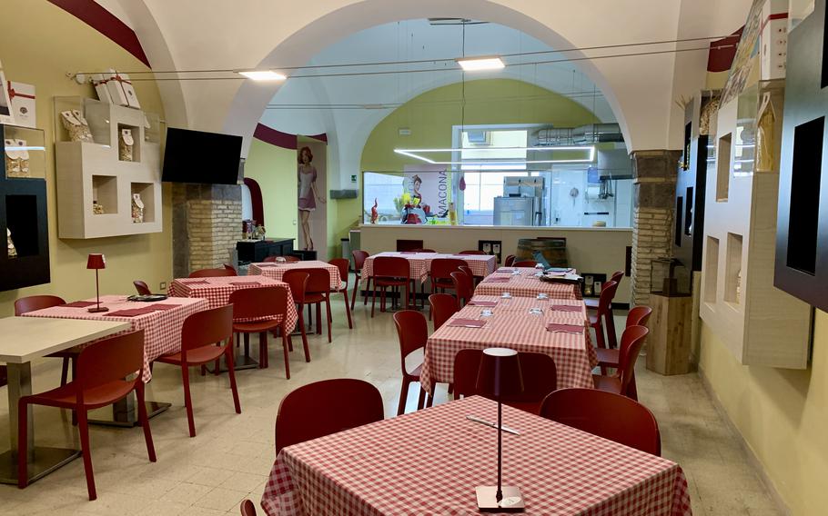 The interior of a traditional Italian restaurant in Naples, Italy.