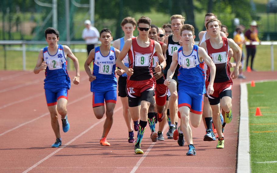 Runners round the track during the boys 1600-meter event at the 2019 DODEA Europe track and field finals. After a canceled 2020 season and a virtual championship last year, athletes are hoping for a traditional ending to the season that starts this weekend.