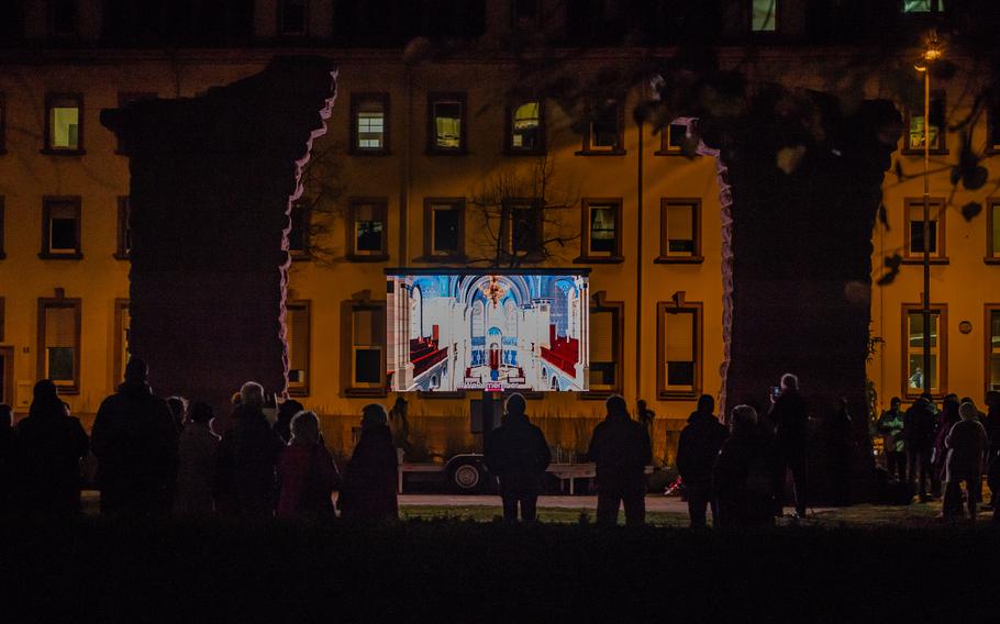 Visitors view a virtual 3D video rendering of the Kaiserslautern Synagogue in its original state in Kaiserslautern, Germany, Nov. 9, 2021. 