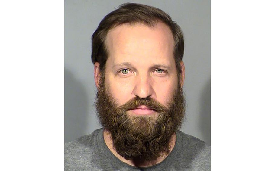 This undated file booking photo provided by Las Vegas Metropolitan Police Department shows Stephen Parshall. Parshall, a Las Vegas man with ties to a far-right extremist group advocating the overthrow of the U.S. government, has been sentenced to federal prison for sexually abusing a young girl., was ordered to serve 33 years in a federal prison on Monday, March 13, 2023, court records show.