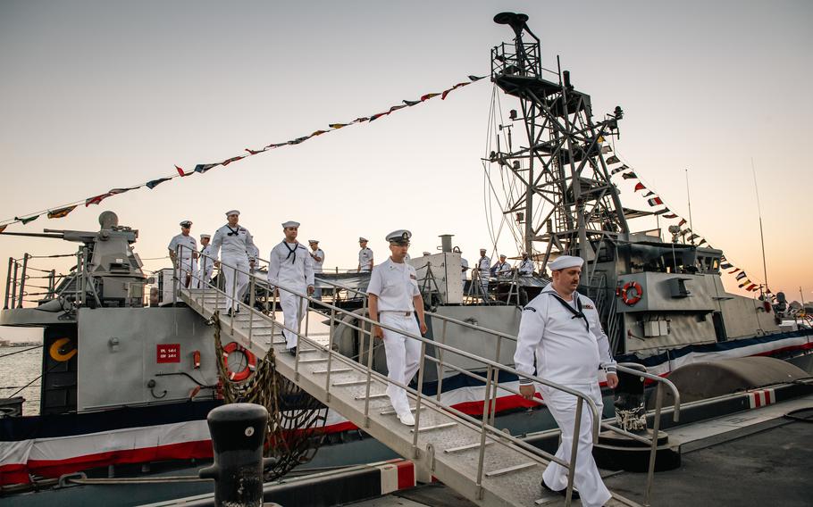 Sailors disembark patrol coastal ship USS Typhoon during the ship's decommissioning ceremony Feb. 28, 2022, at Naval Support Activity Bahrain. Typhoon commissioned in 1994 and began conducting routine coastal patrol operations under U.S. 5th Fleet in 2004.