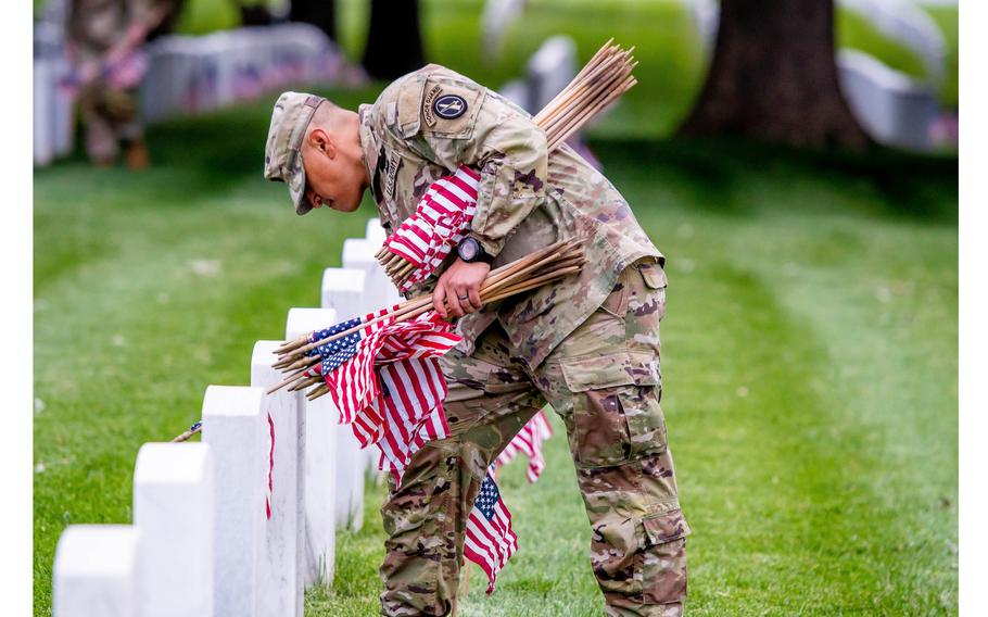 The 3rd U.S. Infantry Regiment, the Old Guard, will begin placing American flags on every grave at Arlington National Cemetery in Arlington, Va., on Thursday, May 25, 2023.