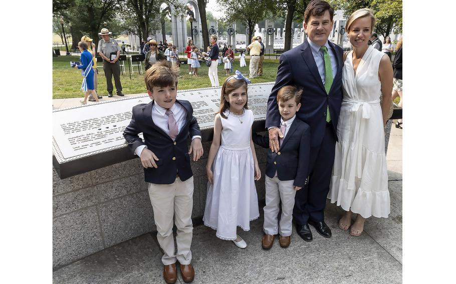 Elliott Roosevelt III, his wife Emily, and children Thatcher, Charlotte and Jameson stand in front of the FDR prayer plaque at the National World War II Memorial in Washington, D.C., on the 79th anniversary of the start of the D-Day invasion, Tuesday, June 6, 2023.