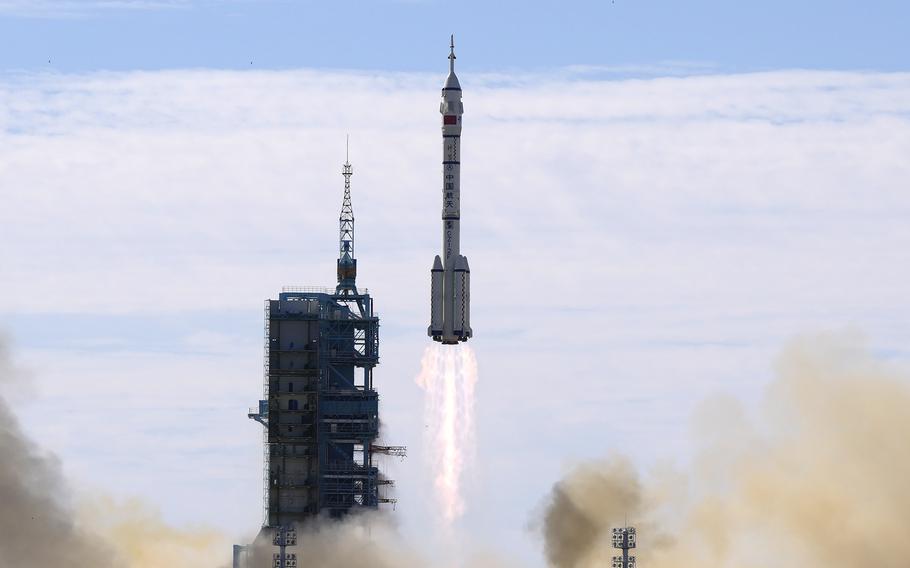 A Long March-2F Y12 rocket carrying a crew of Chinese astronauts in a Shenzhou-12 spaceship lifts off at the Jiuquan Satellite Launch Center in Jiuquan in northwestern China, on Thursday, June 17, 2021.