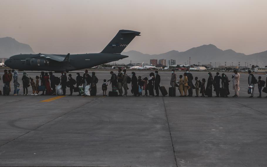 Evacuees wait to board a Boeing C-17 Globemaster III during an evacuation at Hamid Karzai International Airport, Kabul, Afghanistan, Aug. 23, 2021. Qatar expects to have Kabul’s airport “operational very soon” and has urged the Taliban to help facilitate the evacuation of Afghans stranded after the end of a massive U.S. airlift staged as its last troops left the country.