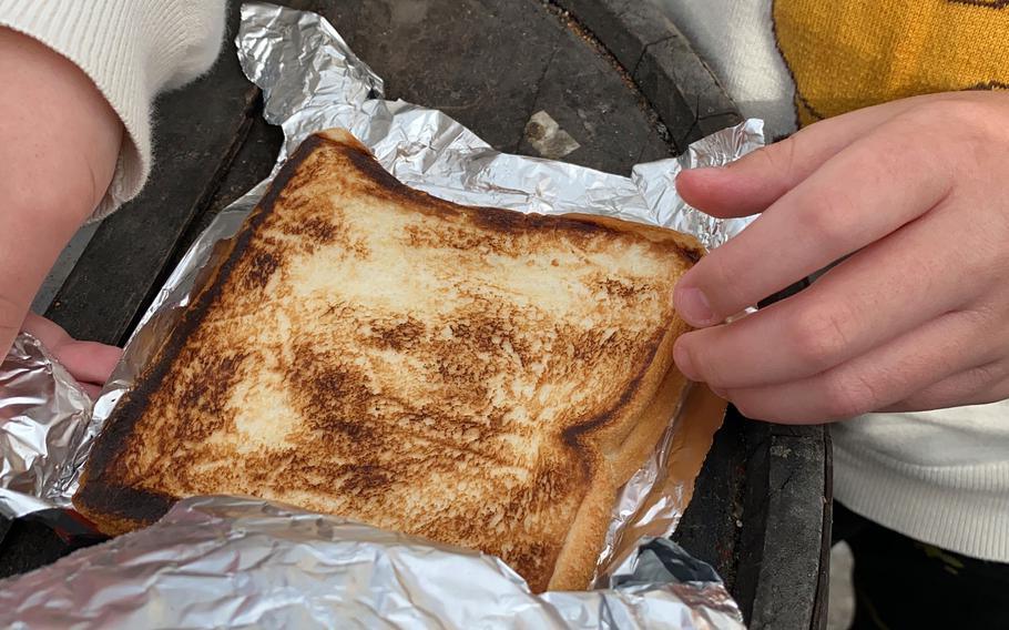 The toasted sandwiches from a retro vending machine outside Used Tire Market in Sagamihara, Japan, pop out wrapped in piping hot aluminum foil. 