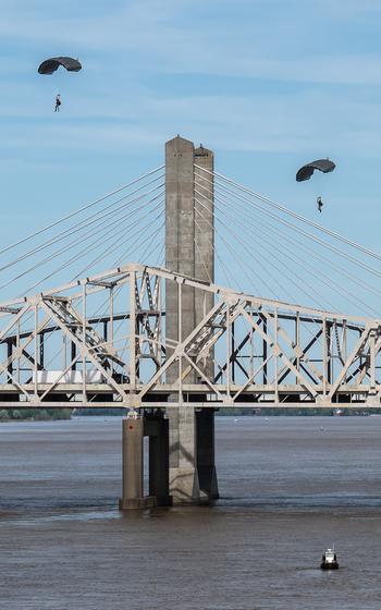 Two pararescuemen from the Kentucky Air National Guard’s 123rd Special Tactics Squadron parachute into the Ohio River as part of a demonstration during the Thunder Over Louisville air show in Louisville, Ky., Saturday, April 20, 2024.
