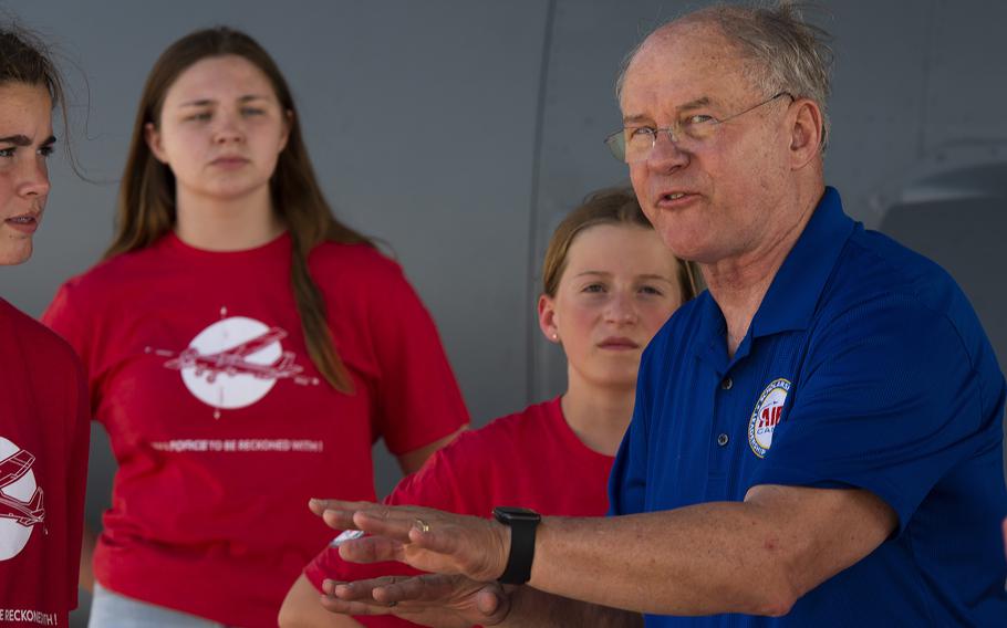 Retired Air Force Lt. Gen. Richard Reynolds talks to Air Camp participants about flying during their visit to Wright-Patterson Air Force Base, Ohio, June 14, 2021. Campers visited Wright-Patt to tour aircraft, learn about firefighting and visit the U.S. Air Force School of Aerospace Medicine.