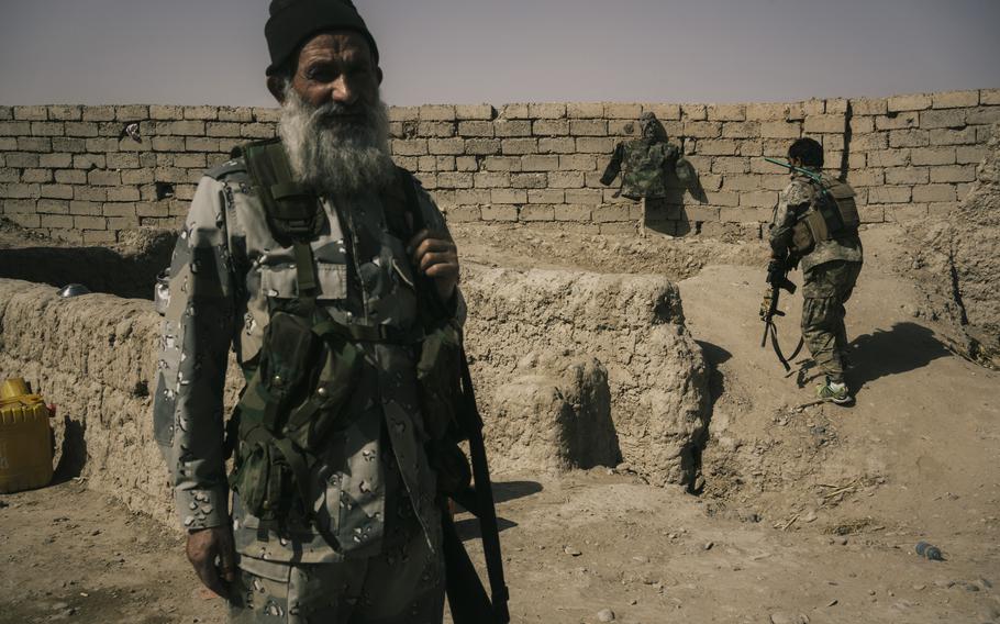 Afghan army soldiers occupy a position on the front line that is exposed to Taliban sniper fire at the Nazar outpost near Lashkar Gah on May 25, 2021. 