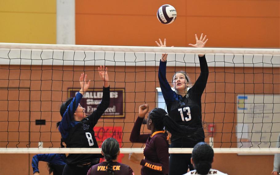 Hohenfels’ Isabel DeBorja, left, and Brynn Ropelewski go up for a block during their match against Vilseck during a scrimmage at the Vilseck High School gym on Sept. 2, 2023.