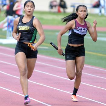 Robert D. Edgren junior Zalea Washington and Zama sophomore Madison Anderson pound for the finish of the girls 400 relay during Saturday’s DODEA-Japan district finals. Edgren edged Zama and also won the 1,600 relay, but Anderson took home first place in the 100 and 200.