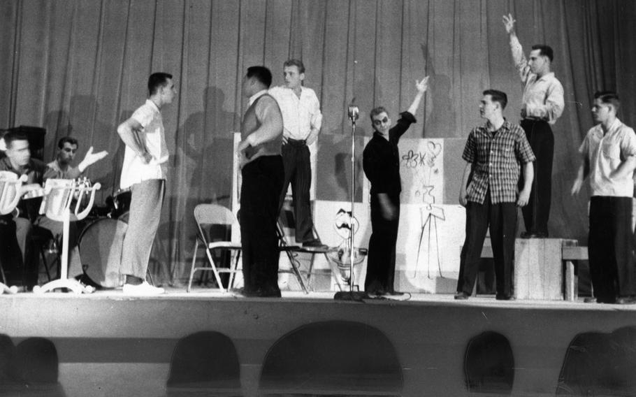 7th Infantry Division musicians and “actors” — some already in partial stage makeup — do a run through onstage of the show before the performance in Seoul. The show, using songs from top Broadway musicals, was based on an idea by Pfc. Tom Wright of the 7th Infantry Division Special Services and was directed by Jack Badcock, Special Services director.