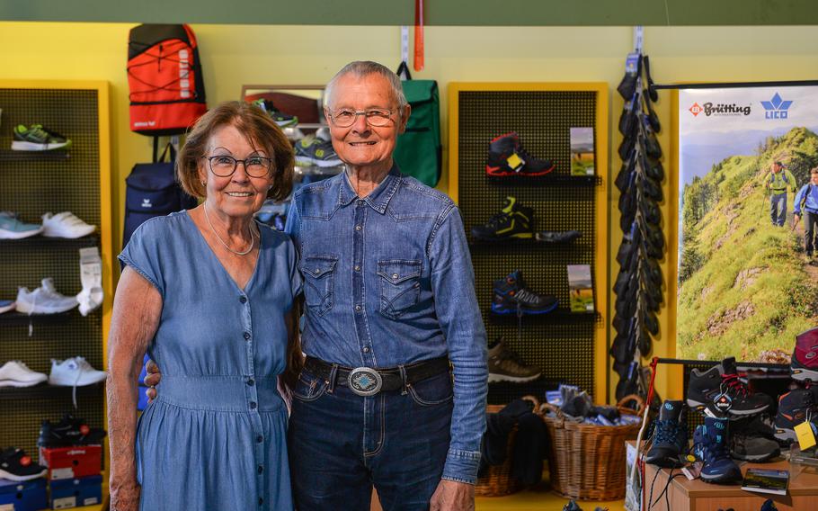 Helga and Otti Walter stand for a photo in their shoe store in Baumholder, Germany, July 12, 2022. Walter said the future of his small footwear retail store, a long-held family business in Baumholder, is uncertain given a waning customer base in the small German town.
