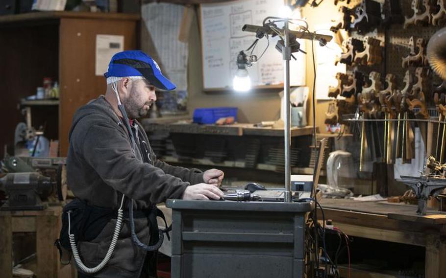Erik Florip works at his shop in Empire, Michigan.  Florip, 37, was exposed to toxic burn pits while he served with the U.S. Marine Corps in Afghanistan and had a glioblastoma the size of a lime removed from his brain in June. Glioblastoma recently was added to a list of conditions that are presumed to have been caused by exposure to burn pits that smoldered continuously at American military bases in the Middle East.