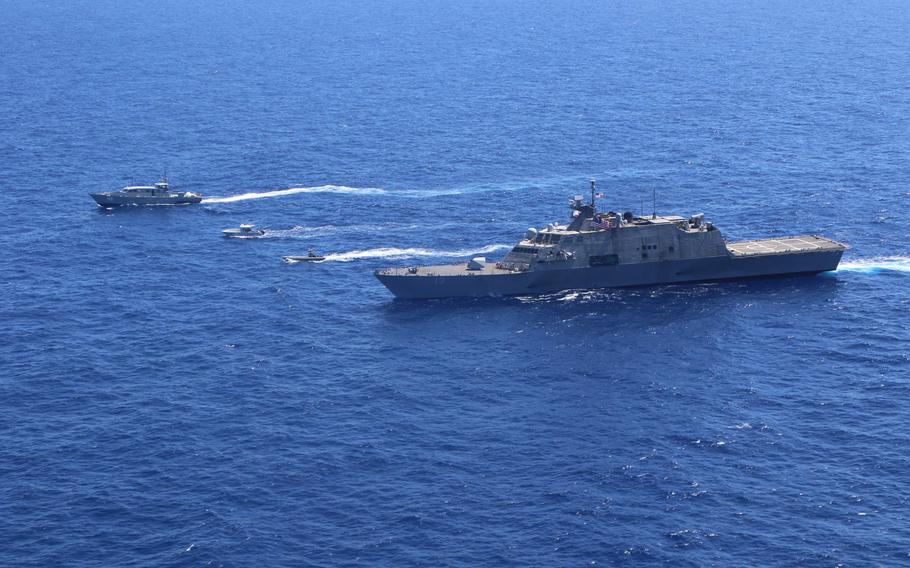 The Freedom-variant littoral combat ship USS Wichita (LCS 13) and boats from the Dominican Republic conduct a bilateral maritime interdiction exercise, May 5, 2022, in the Carbbean Sea. 