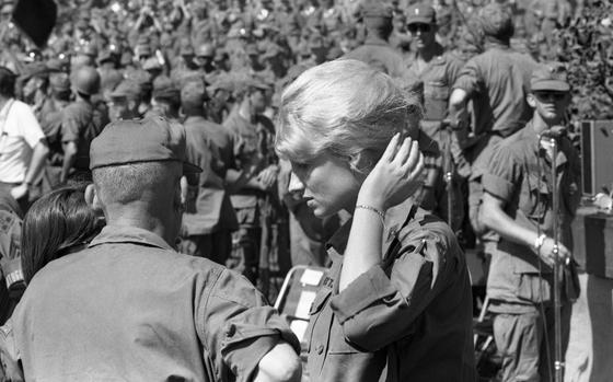 Pleiku, South Vietnam, Dec. 20, 1966: An unidentified Army nurse at Bob Hope's 1966 Christmas Show. 

Some 11,000 women served in Vietnam, with 90% of them working as volunteer nurses. The nature of warfare in Vietnam made it impossible to be safe "behind the front lines," and eight women, all nurses, are among the more than 58,000 names on the Vietnam Veterans Memorial. 

Their names are: Capt. Elanor Grace Alexander, 2nd Lt. Pamela Dorothy Donovan, 2nd Lt. Carol Ann Elizabeth Drazba, Lt. Col. Annie Ruth Graham, 2nd Lt. Elizabeth Ann Jones, 1st Lt. Sharon Ann Lane, and 1st Lt. Hedwig Diane Orlowski.

META TAGS: Women in the Military; Women's History Month; Bob Hope Christmas Show; Vietnam War; war; Army Nurse Corps