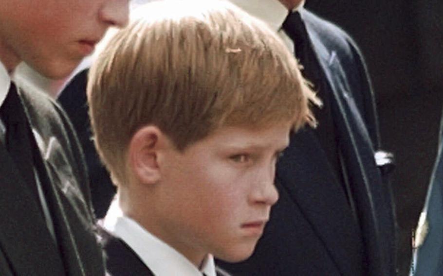 Britain’s Prince Charles, the Prince of Wales and his sons Prince William, left and Prince Harry wait for the coffin of Princess Diana to be loaded into a hearse outside of Westminster Abbey, in London on Sept. 6, 1997. An explosive memoir reveals many facets of Prince Harry, from bereaved boy and troubled teen to wartime soldier and unhappy royal. From accounts of cocaine use and losing his virginity to raw family rifts, “Spare” exposes deeply personal details about Harry and the wider royal family. It is dominated by Harry’s rivalry with brother Prince William and the death of the boys’ mother, Princess Diana in 1997. 
