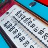 A thermometer on a blue background.