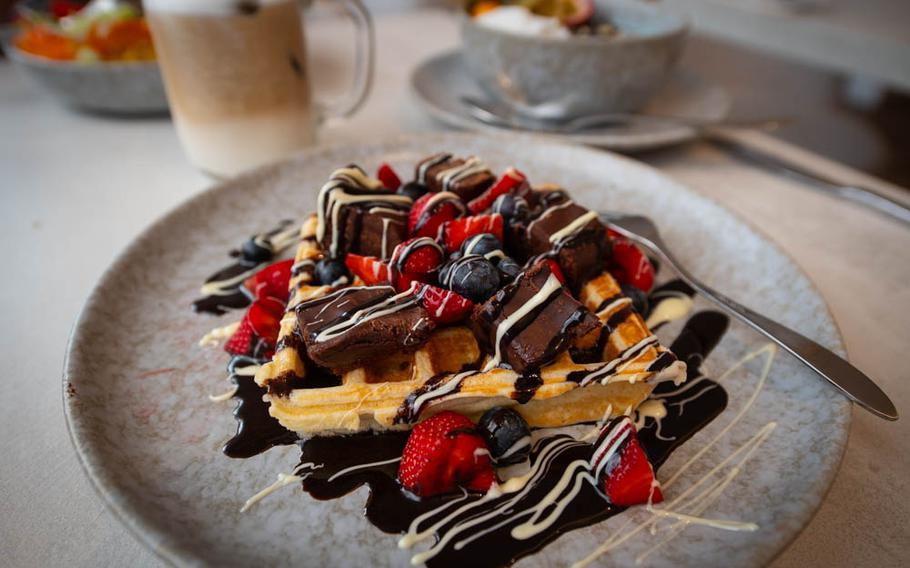 The "Best I ever had" waffle at The Parlour in Landstuhl, Germany, is served with homemade brownies, fresh strawberries and a drizzle of dark and white chocolate. The restaurant also serves a decadent version with Rafaello and Kinder Bueno chocolate bites.