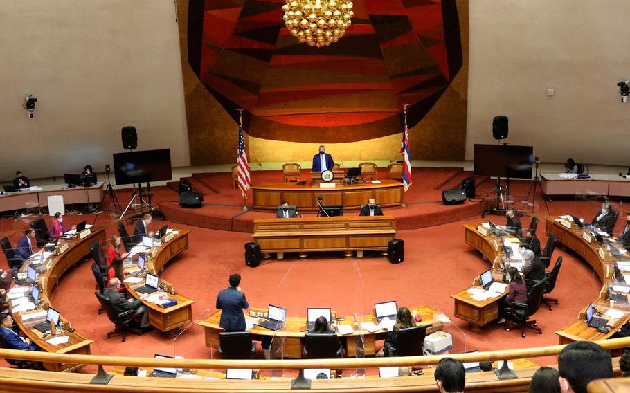 Members of the Hawaii House of Representatives discuss legislation at the Hawaii State Capitol in Honolulu, on Tuesday, May 3, 2022. Hawaii lawmakers have passed legislation that would hike the state's minimum wage to $18 an hour by 2028, potentially the highest in the nation.