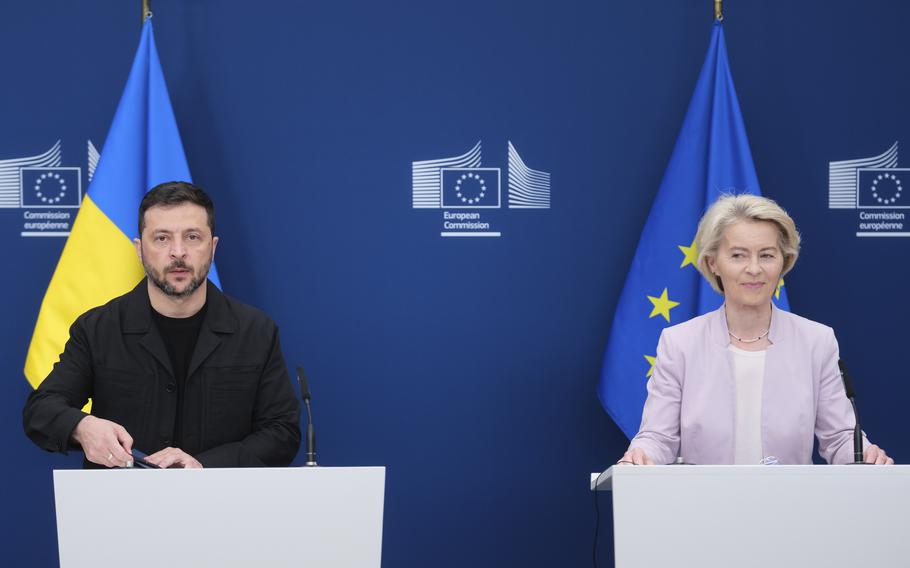 Zelenskyy and von der Leyen stand at microphones with the flags of Ukraine and the EU behind them.