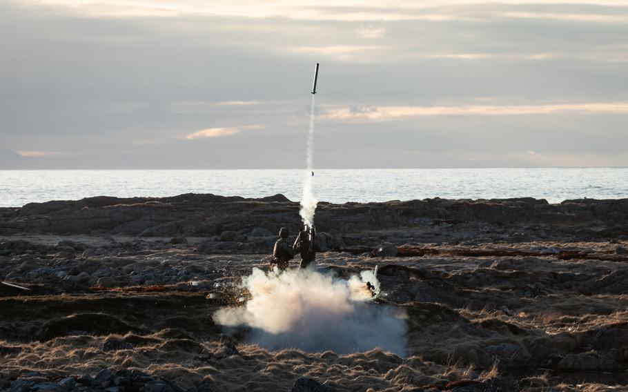 A Stinger missile takes flight, leaving smoke in its wake.