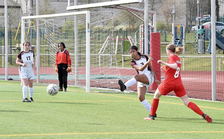 Vilseck's Valerie Vizcaino, center right, clears the ball ahead of Kaiserslautern's Brooke Rawcliffe, right, on Saturday morning at Kaiserslautern High School in Kaiserslautern, Germany. At left are the Falcons' Maci Blackman and Nyja Flournoy.