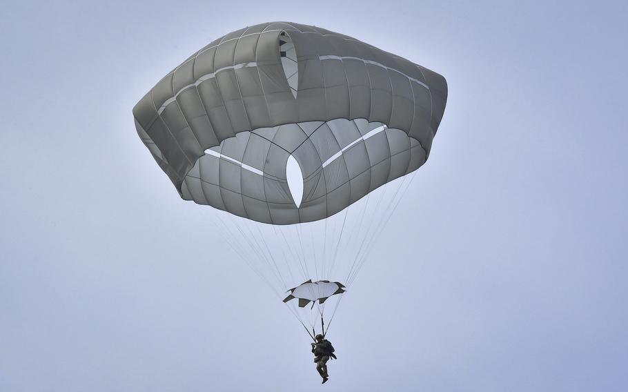 A soldier from the 173rd Airborne Brigade glides toward the ground March 14, 2024, during an all-female jump onto the Juliet Drop Zone near Vajont, Italy.
