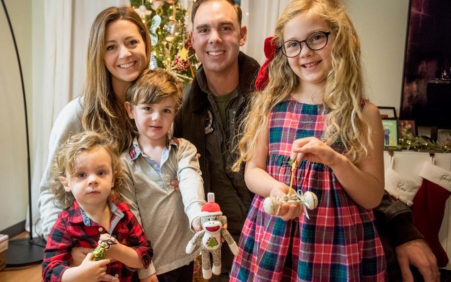 The Tombes children show some of the Christmas tree ornaments they received as part of a family tradition each year. From left, Liam, Ashley, Jack, Thomas and Abigail photographed at their home at Marine Corps Air Station Iwakuni, Japan, on Dec. 14, 2022.