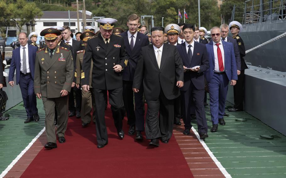 In this photo released by Russian Defense Ministry Press Service on Saturday, Sept. 16, 2023, North Korea's leader Kim Jong Un, center right, Russian Defense Minister Sergei Shoigu, left, and Admiral Nikolai Yevmenov, Commander-in-Chief of the Russian Navy, center left, visit the Admiral Shaposhnikov frigate of the Russian navy in the port of Vladivostok, Russian Far East.