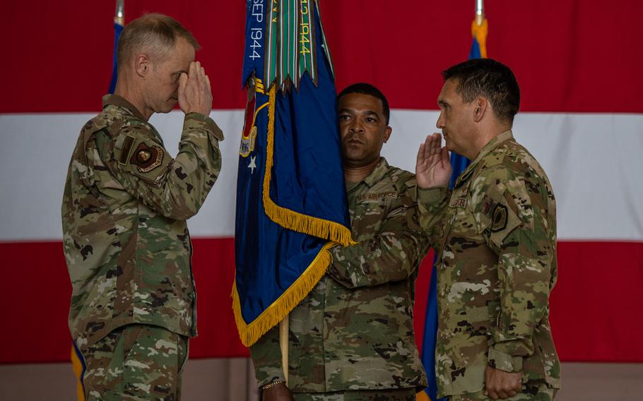 Col. Jason Chambers, right, salutes Maj. Gen. Derek France upon uncasing the colors and assuming command of the newly activated 406th Air Expeditionary Wing during a change of command ceremony June 9, 2023, at Ramstein Air Base, Germany. The wing will continue the now deactivated 435th Air Expeditionary Wing’s mission of providing airfield support, intelligence, tactical airlift, personnel recovery and logistics support in Africa.
