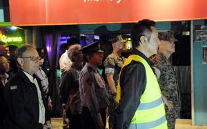Okinawa Gov. Denny Tamaki, far left, joins a U.S.-Japan patrol of Gate 2 Street in Okinawa city, Okinawa, April 18, 2025. 