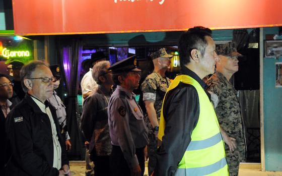 Okinawa Gov. Denny Tamaki, far left, joins a U.S.-Japan patrol of Gate 2 Street in Okinawa city, Okinawa, April 18, 2025. 