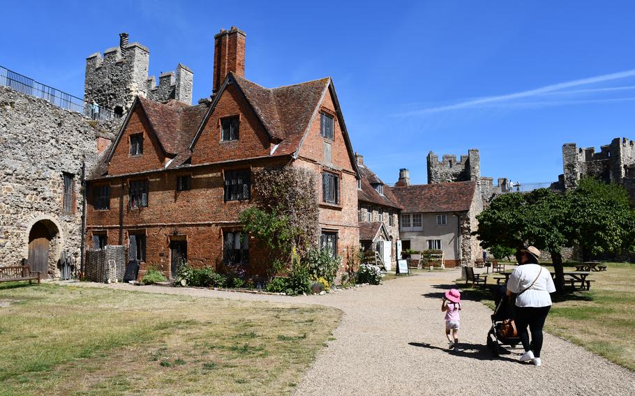 A combination of buildings erected in 1664 are situated within Framlingham castle. The door to the left of the red building leads to the castle dungeon. 