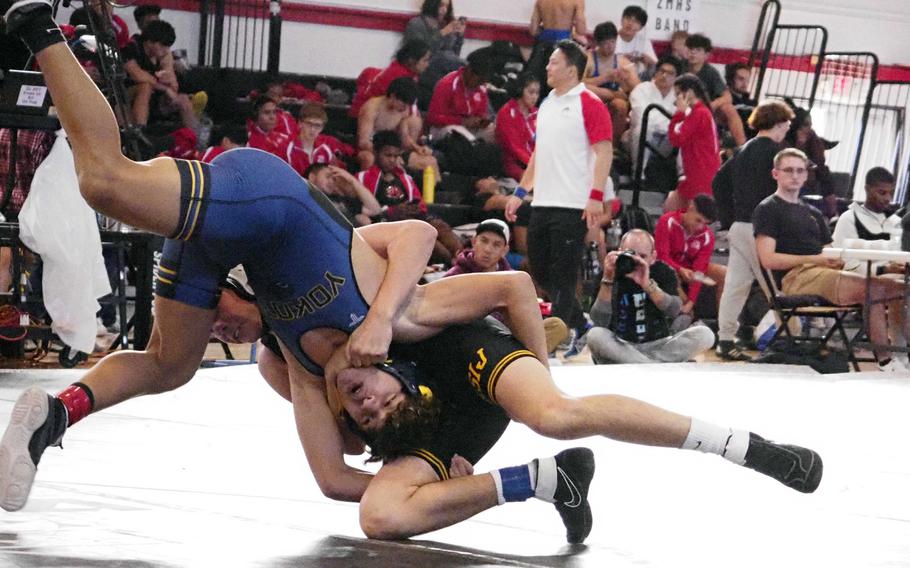 Yokota 129-pounder Landon Reyes shoots on American School In Japan’s Asher Cook during Saturday’s Zama  Invitational.