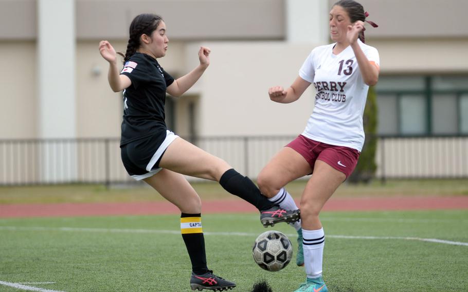 Zama‘s Lindsey So and Matthew C. Perry’s McKenzie Steele tussle for the ball during Saturday’s DODEA-Japan girls soccer match. The Samurai won 4-1.