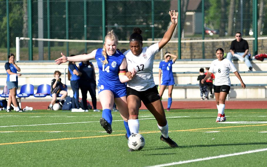 Ramstein's Jillian Buckley and Kaiserslautern's Jedaiah Quinland jostle for the ball during a match on April 12, 2024, at Ramstein High School on Ramstein Air Base, Germany.