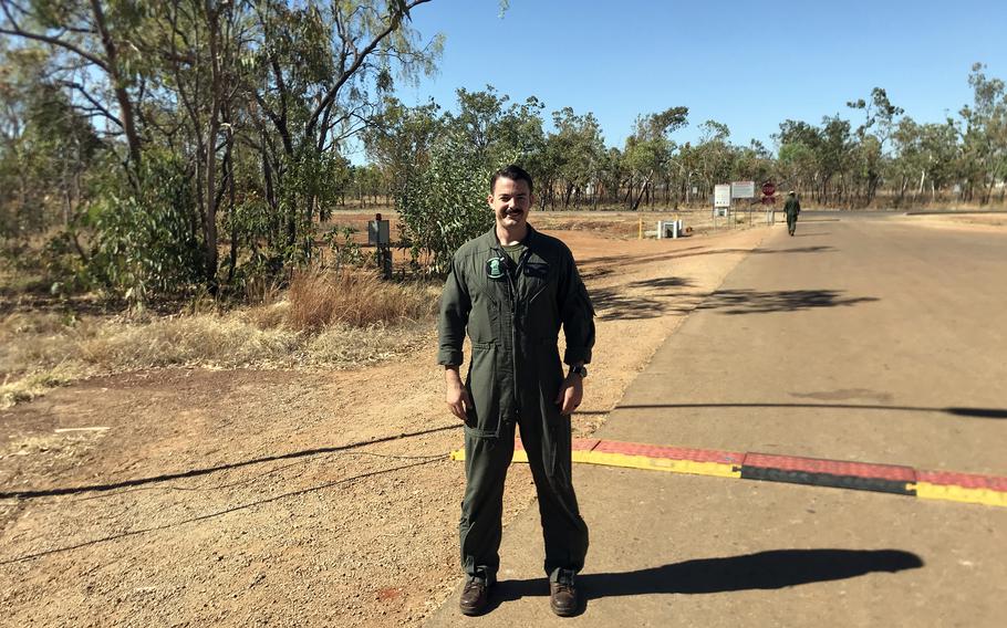 Capt. Brandon Howard, an F-35B Lightning II pilot with Marine Fighter Attack Squadron 121, poses on a dusty road near Royal Australian Air Force Base Tindal’s runway, Thursday, Sept. 1, 2022. 