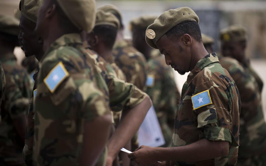 A Somali soldier stands in formation at a logistics course graduation ceremony Aug. 17, 2018, in Mogadishu, Somalia. A different Somali soldier attending the Defense Language Institute at Joint Base San Antonio ran off, forcing the U.S. Air Force to declare him AWOL, according to a recent Defense Department Inspector General report. 