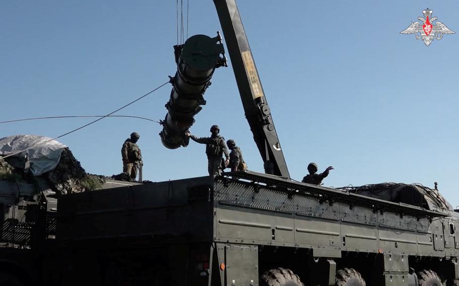 Russian service members are seen atop an Iskander missile launching system capable of carrying a nuclear warhead during the first stage of military drills, involving practical training in the preparation and use of non-strategic nuclear weapons, at an unknown location in Russia’s Southern Military District, in this still image taken from video released May 21, 2024. 