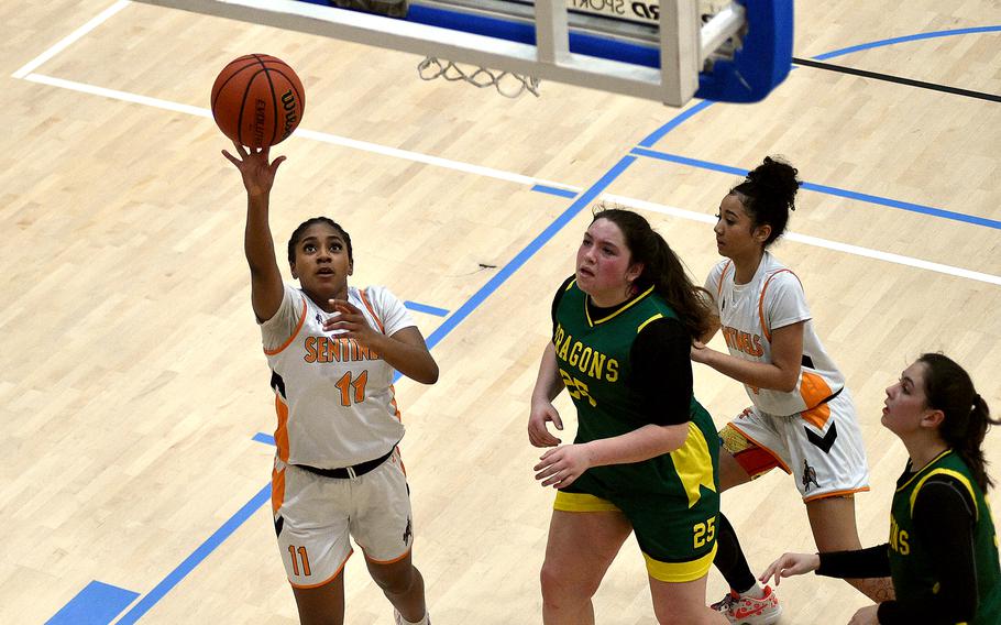 Spangdahlem senior Gabrielle Schmidt lays up a shot in the paint during pool-play action of the DODEA European basketball championships against Alconbury on Feb. 14, 2024, at the Wiesbaden Sports and Fitness Center on Clay Kaserne in Wiesbaden, Germany.