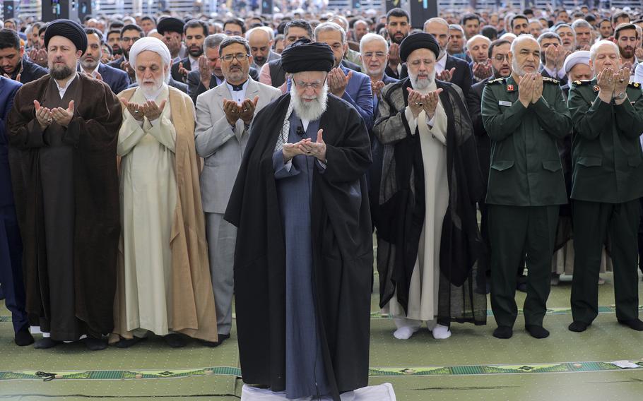 In this photo released by an official website of the office of the Iranian supreme leader, Supreme Leader Ayatollah Ali Khamenei leads Eid al-Fitr prayer marking the end of the Muslim holy fasting month of Ramadan, in Tehran, Iran, Wednesday, April 10, 2024.