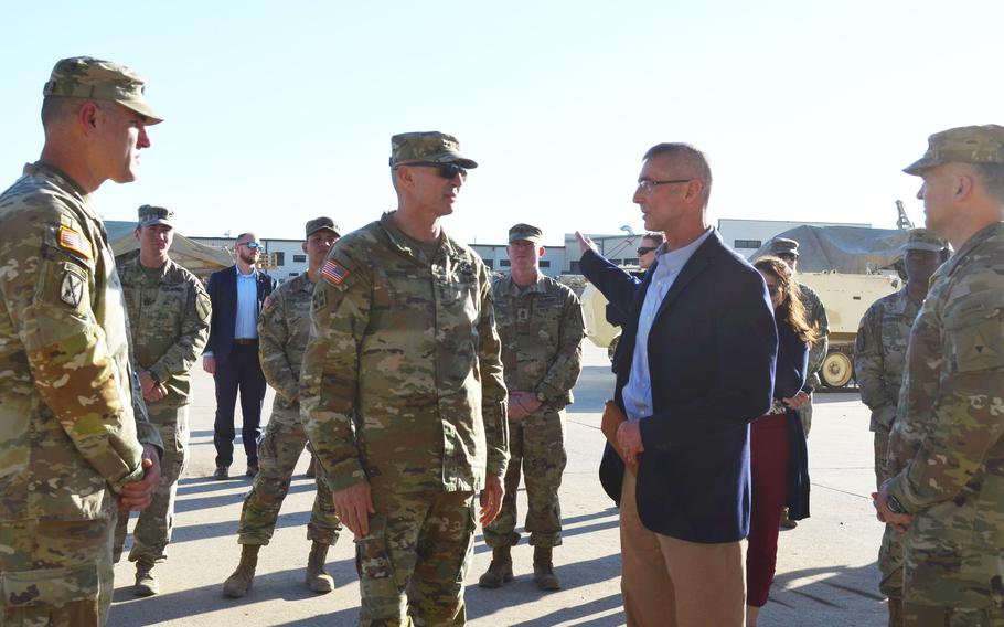 Gen. Randy George, the Army chief of staff, center left, on Tuesday, Feb. 20, 2024, listens to Brian Dosa, director of Public Works at Fort Cavazos, discuss motor pool facilities at the Texas post.
