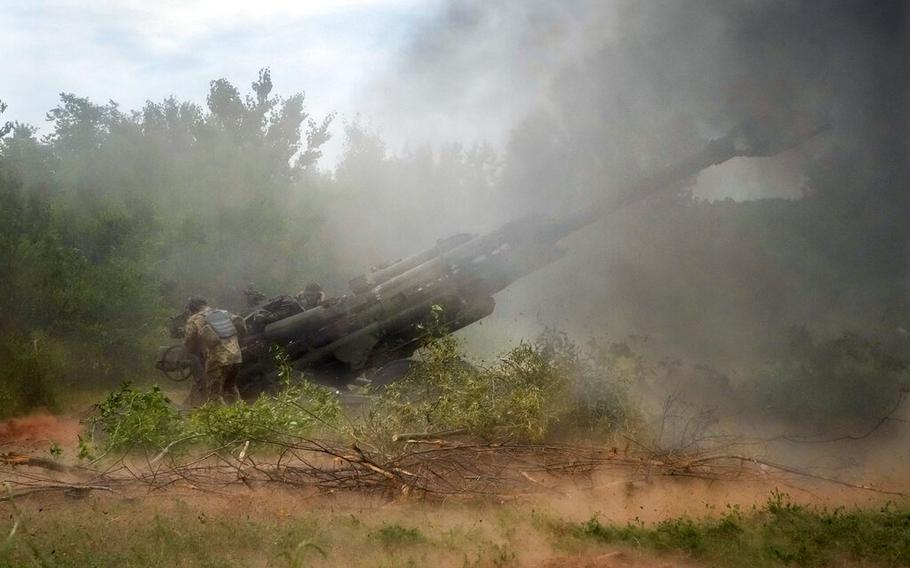 Ukrainian soldiers fire at Russian positions from a U.S.-supplied M777 howitzer in Ukraine’s eastern Donetsk region Saturday, June 18, 2022.  