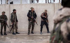 Syrian Democratic Forces soldiers hold a position in Hassakeh, northeast Syria, Thursday, Jan. 27, 2022. 