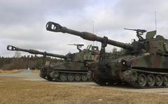 In this image provided by the U.S. Army, U.S. Soldiers from Battery A, 41st Field Artillery Regiment, 1st Armored Brigade Combat Team, 3rd Infantry Division, conduct live-fire exercises using the M109 Paladins at the Grafenwoehr Training Area, March 14, 2022. The first class of 635 Ukrainian fighters has finished a five-week advanced U.S. training course in Germany on sophisticated combat skills and armored vehicles, including M109 Paladins, that will be critical in the coming spring offensive against the Russians, the Pentagon said Friday, Feb. 17, 2023. (Capt. Patrick M. Connelly/U.S. Army via AP)