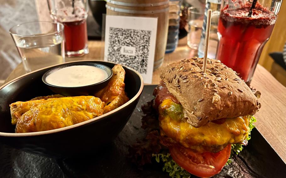 The "German High Roller" burger, served with a side of potato wedges at Bruno's Burger & Lieblingsgerichte restaurant in Neustadt an der Weinstrasse, Germany, Nov. 13, 2021. Burgers and additional dishes are made with mostly locally sourced ingredients and prepared fresh, in house. 