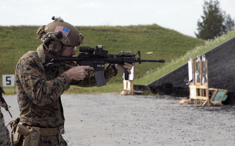 Marine Cpl. Bela Szabo of 3rd Reconnaissance Battalion fires a round during the Far East Marksmanship Competition at Camp Hansen, Okinawa, Dec. 7, 2022.